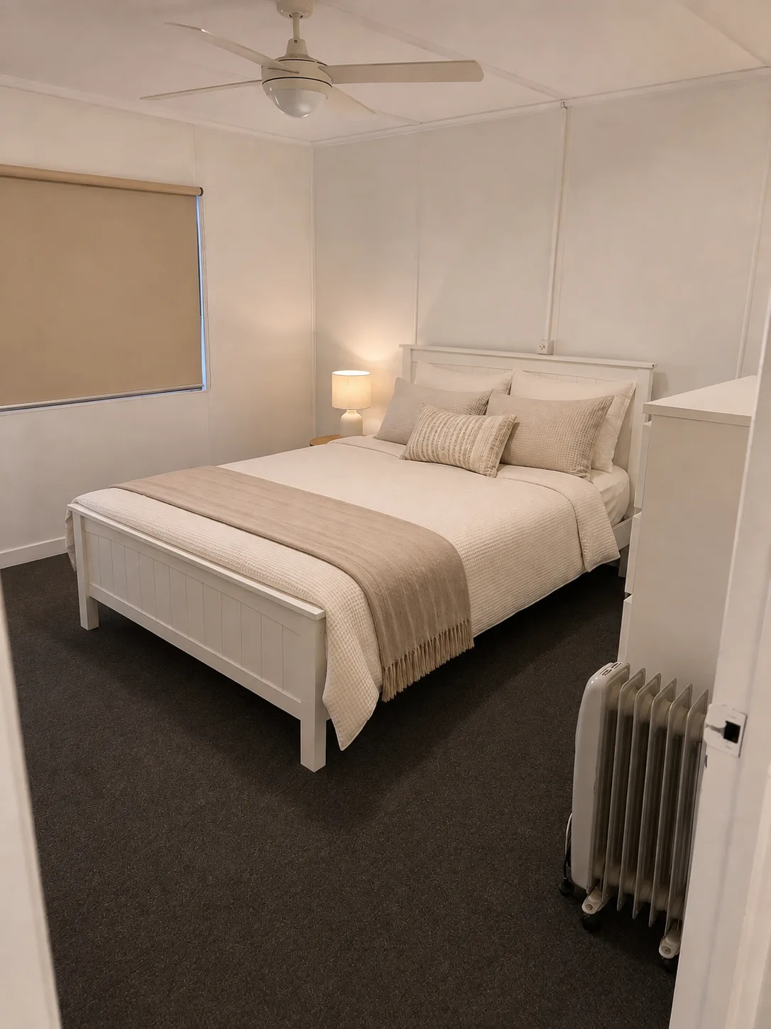 Third bedroom at Cozy on Hudson holiday home in Port Lincoln with a queen bed, white frame, textured linen and ceiling fan